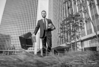 boxing day. handsome man with present box. boss carry birthday gift. guy hold shopping bags. mens day. happy businessman with packages. sale and discount. surprise for her. be my valentine.