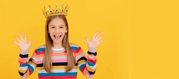 glad teen child in queen crown on yellow background. Child queen princess in crown horizontal poster design. Banner header, copy space