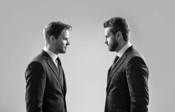 businessmen face to face. disrespect and contradiction. business partners blame each other. arguing businesspeople. dissatisfied men discuss failure. two colleagues have disagreement and conflict.