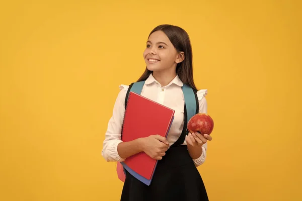 Happy Kid Smile Holding Books Apple Yellow Background School Snack — Stock Photo, Image
