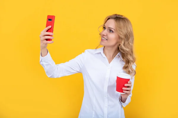 Cheerful Blonde Woman Coffee Cup Making Selfie Phone Yellow Background — Stockfoto