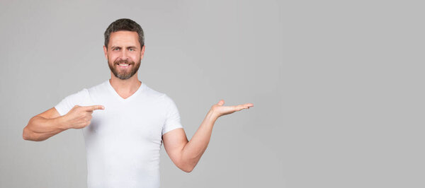 Your advertisemen everywhere. Presenting product. Place advertisement there, copy space. Man face portrait, banner with copy space