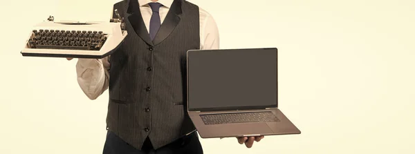 cropped man showing laptop and typewriter isolated on white background, copy space, presenting product.