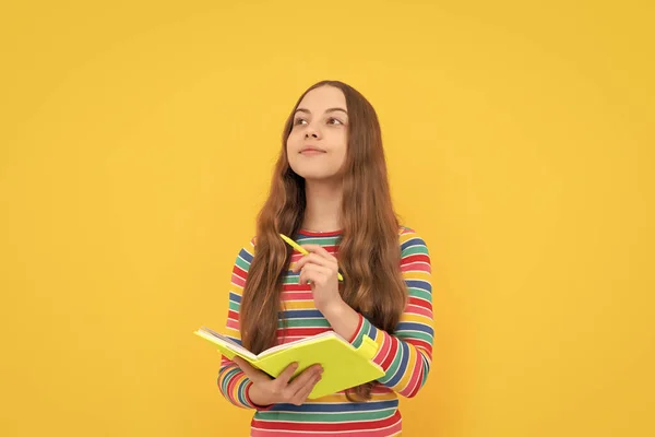 Think Writing Child Think Holding Copybook Pen Thoughtful Girl Yellow — стоковое фото