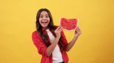 surprised teen girl going to eat water melon slice, summer.