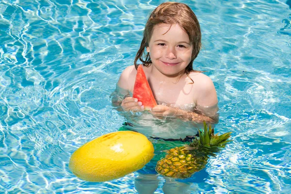 Happy child playing in swimming pool. Summer kids vacation