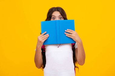 Back to school. Schoolgirl student with school bag backpack hold book on isolated studio background. School and education concept. Teenager girl in school uniform