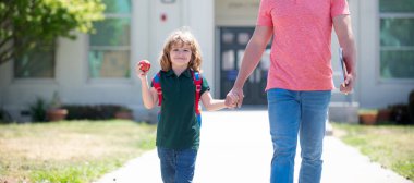 Banner of child back to school, nerd with teacher hold apple. education. first day at school. father and son come back from school.