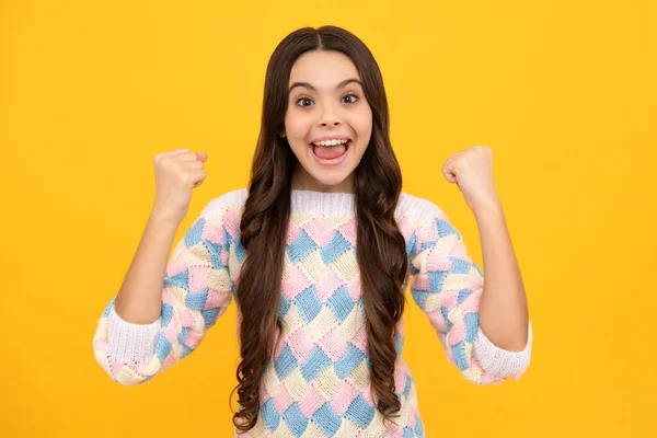 Amazed teen girl. Excited expression, cheerful and glad. Joy, victory, celebration and excitement concept. Excited face. Amazed expression, cheerful and glad