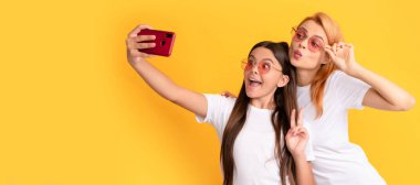 Mother and daughter child banner, copy space, isolated background. .selfie family. modern life. mobile technology. having video call. mother and daughter vlogging