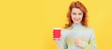 Woman with coffee cup. woman pointing finger on plastic cup. good morning. express happiness. positive emotions. Woman isolated face portrait, banner with copy space