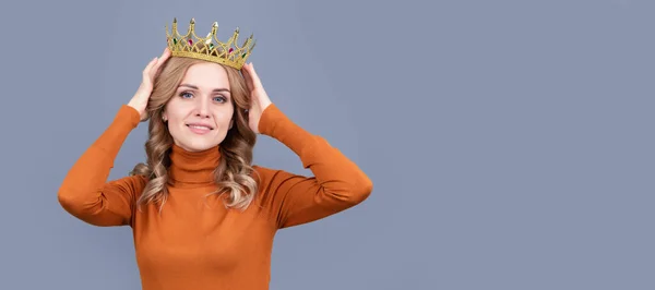 Princess woman with crown. smiling blonde girl with curly hair wear crown, egoism. Woman portrait, isolated header banner with copy space