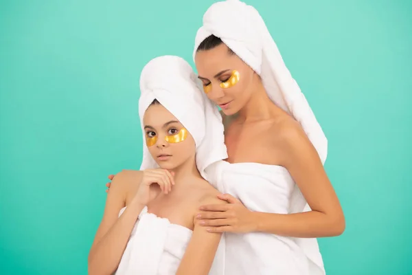 family spa of mother and daughter with moisturizing patch.