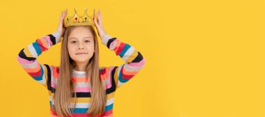 selfish teen child in queen crown on yellow background. Child queen princess in crown horizontal poster design. Banner header, copy space