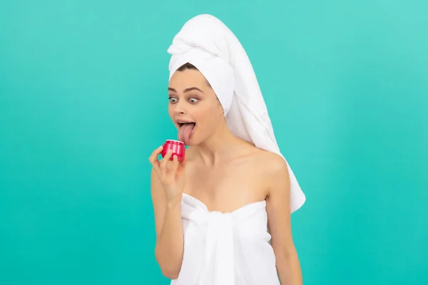 Amazed Young Woman Towel Licking Skin Cream Blue Background — Stockfoto