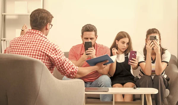 psychologist give family therapy for phone addicted dad mom and daughter girl, dependency.
