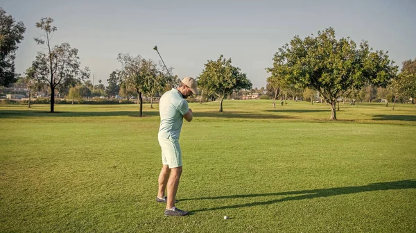 male golf player on professional course with green grass, golf.