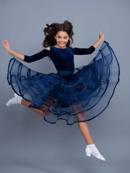 Excited face, cheerful emotions of teenager girl. Happy teenager, positive and smiling emotions. Full length of excited teenager child in summer dress jump isolated on gray background studio