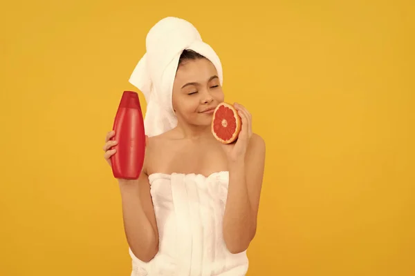 Smiling Teen Girl Towel Grapefruit Shampoo Bottle Yellow Background — Stock Photo, Image