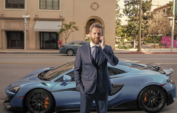 businessperson rent a luxury car by phone.