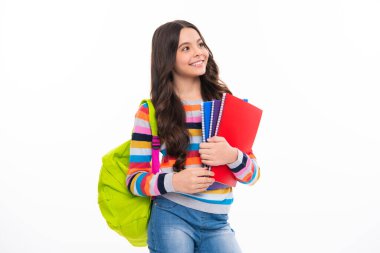 School teenage girl with school bag backpack hold book on white isolated studio background. Children school and education concept. Happy girl face, positive and smiling emotions