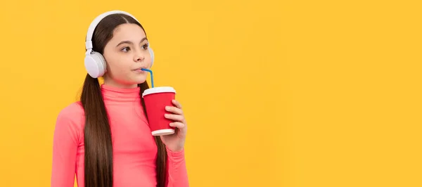 Serious Child Listen Music Headphones Drink Paper Cup Yellow Background — Photo