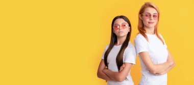 Mother and daughter child banner, copy space, isolated background. young girls in eyeglasses. portrait of happy child and mom. express positive emotions