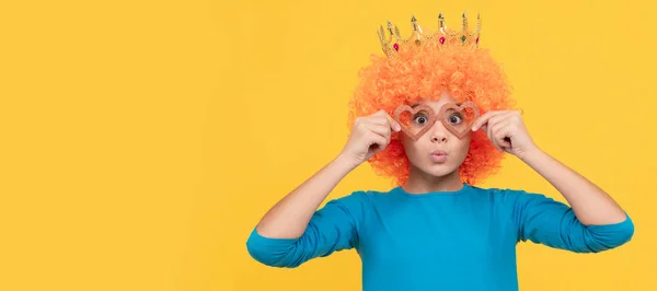 just having fun. fancy party look. egocentric kid in clown wig and crown. Funny teenager child in wig, party poster. Banner header, copy space