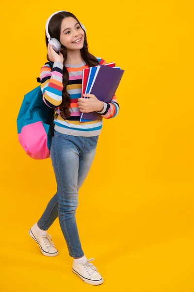 Schoolgirl Teenage Student Lifestyle Girl Headphones Hold Books Yellow Isolated — Foto de Stock