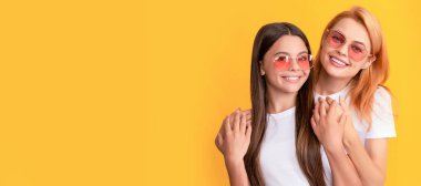 Mother and daughter child banner, copy space, isolated background. happy family portrait of loving mom and child girl in glasses, family love
