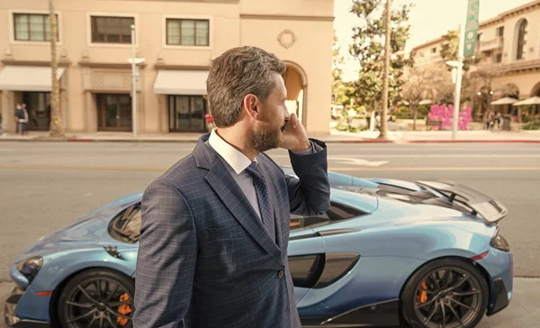 businessperson rent a luxury car by phone. negotiation.