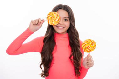 Teenager girl with caramel candies on sticks, sweet sugar addiction. Child with lollipops. Happy girl face, positive and smiling emotions