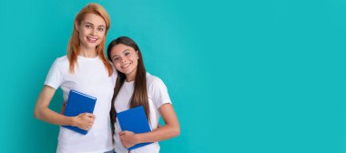 Mother and daughter child banner, copy space, isolated background. friendly private teacher and child holding book, knowledge