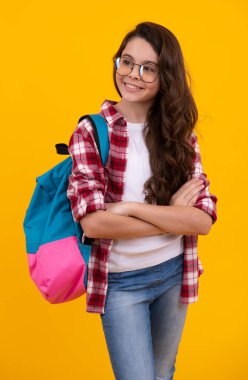 Schoolgirl with backpack. Teenager student, isolated background. Learning and knowledge. Go study. Children education concept. Back to school. Happy teenager, positive and smiling