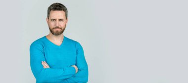 Man face portrait, banner with copy space. handsome mature man with beard on grey background, style