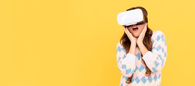 amazed teen girl wear vr glasses using future technology for education in virtual reality. Banner of child girl with virtual reality vr headset, studio portrait with copy space