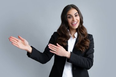 Woman point at copy space, showing copyspace pointing. Promo, girl showing advertisement content gesture, pointing with hand recommend product. Isolated background. Female office worker, success