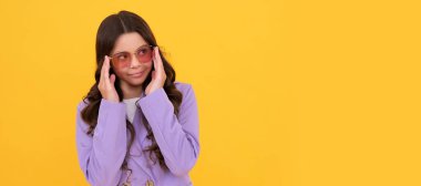 portrait of happy child on yellow background. express positive emotions. Child face, horizontal poster, teenager girl isolated portrait, banner with copy space