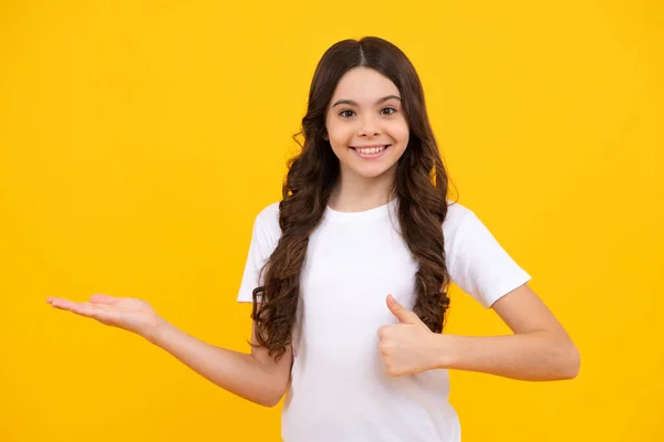 Positive Teenager Child Points Aside Cheerful Expression Shows Amazing Blank — Stock fotografie