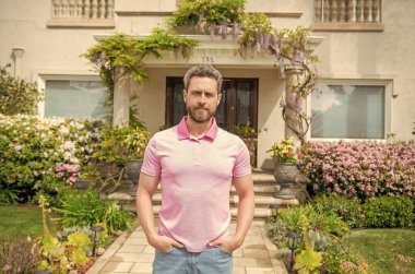 property insurance services. ownership. american settlement agent at beautiful house. real estate agent sell property. realtor in suburb neighborhood. man purchasing house for investment purpose.