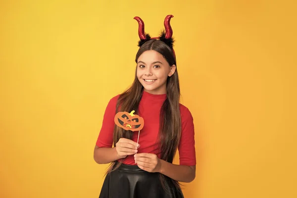 Happy Kid Pumpkin Party Accessory Wearing Devil Horns Yellow Background — Foto de Stock