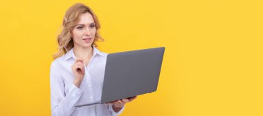 busy businesswoman in white shirt work online with laptop on yellow background, entrepreneur. Woman isolated face portrait, banner with mock up copy space