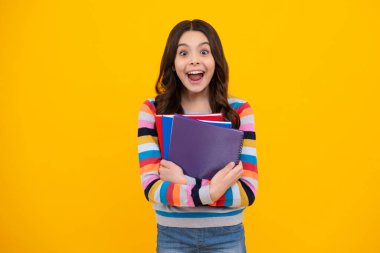 Amazed teenager. Teenager school girl study with books. Learning knowledge and kids education concept. Excited teen girl