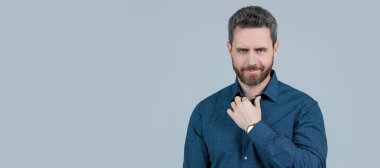 Casual appearance without having to don a tie. Bearded man wear shirt. Wearing smart casual. Man face portrait, banner with copy space