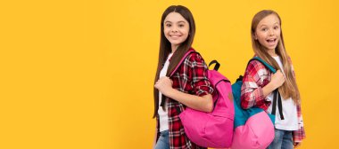 School girls friends. happy teen girls carry backpack. back to school. knowledge day. concept of education. Banner of schoolgirl student. School child pupil portrait with copy space