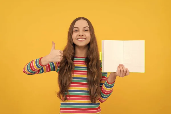 Happy Kid Give Thumbs Hand Gesture Holding Open Book Copy — Stock Photo, Image