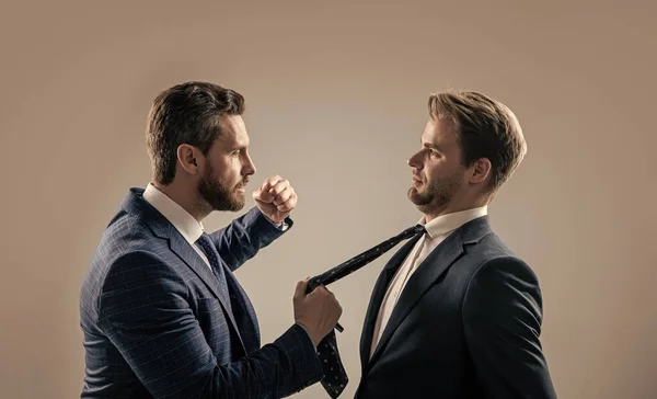 businessmen punching in fight. disrespect and contradiction. business partners blame each other. arguing businesspeople. dissatisfied men. fist in face. colleagues have disagreement conflict.