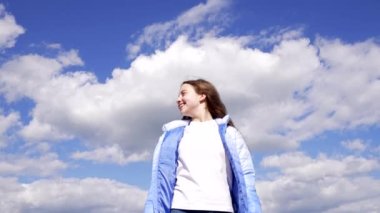 happy tween girl in autumn jacket enjoy the sun on sky background, happiness.
