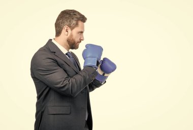 I fight because I can. Businessman ready to fight. Professional man in boxing position. Manager in boxing gloves and suit. Fighting employee stand sideway, copy space.