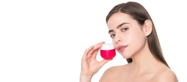 Woman beauty face, close up portrait, isolated banner with copy space. woman use face cream. young girl hold hair mask. lady with skin cream